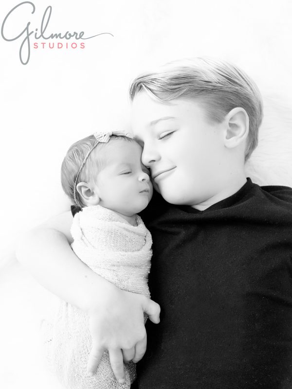 big brother hold his new baby sister, family newborn photographer