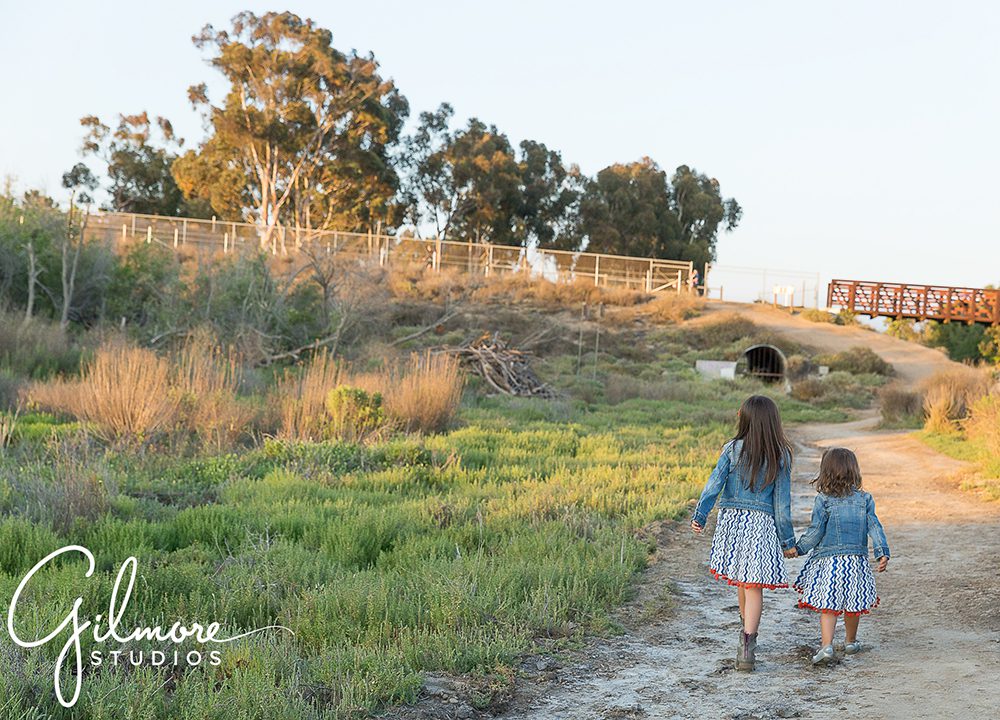 walking down the trail at the Newport Beach back bay for a photography session