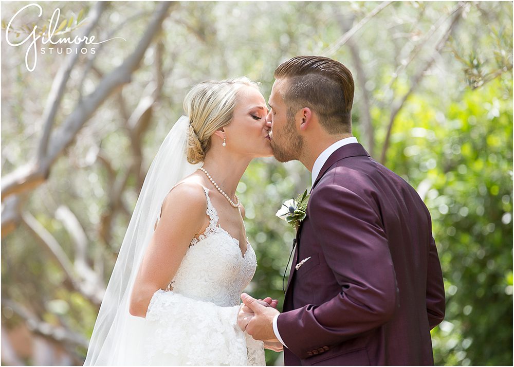 bride and groom kissing, first glance, 1st look, Rancho Valencia