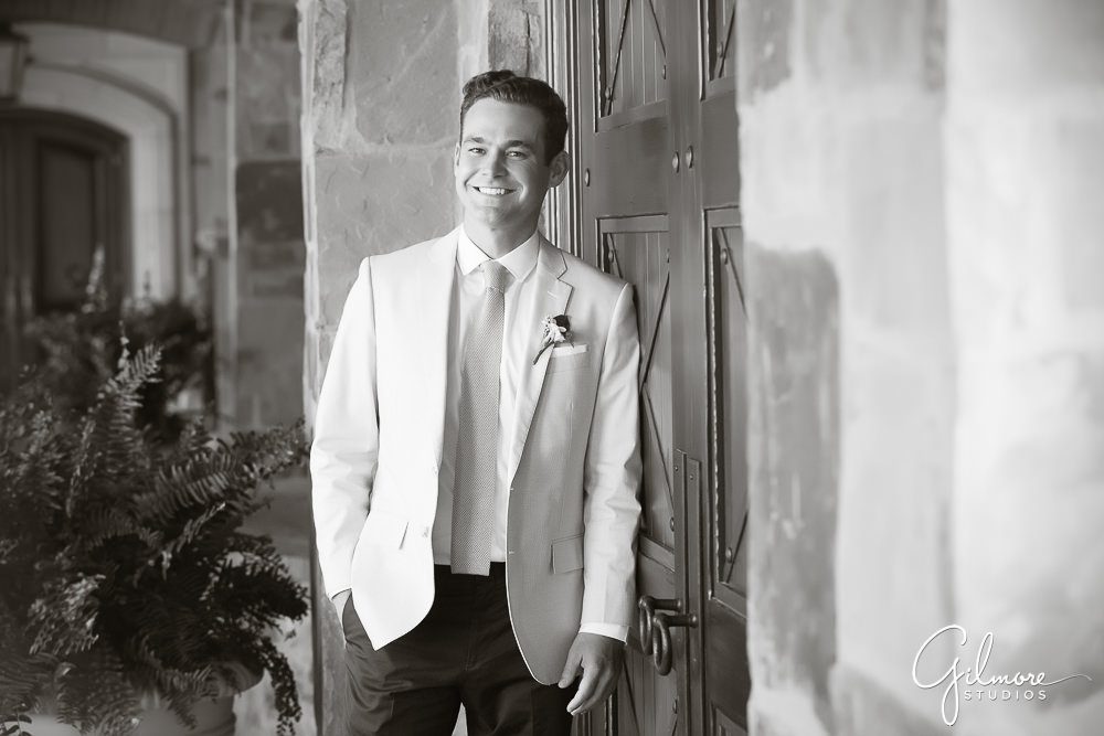 groom poses for a solo photograph before the wedding