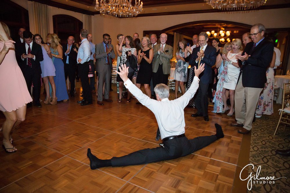wedding guest does the splits on the dance floor