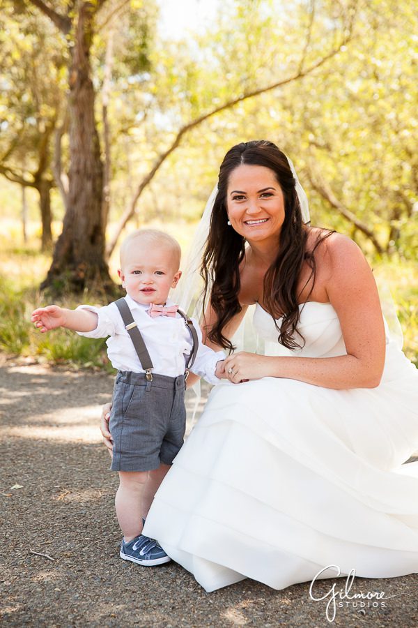 Bride gets a photo with her 2 year old ring bearer