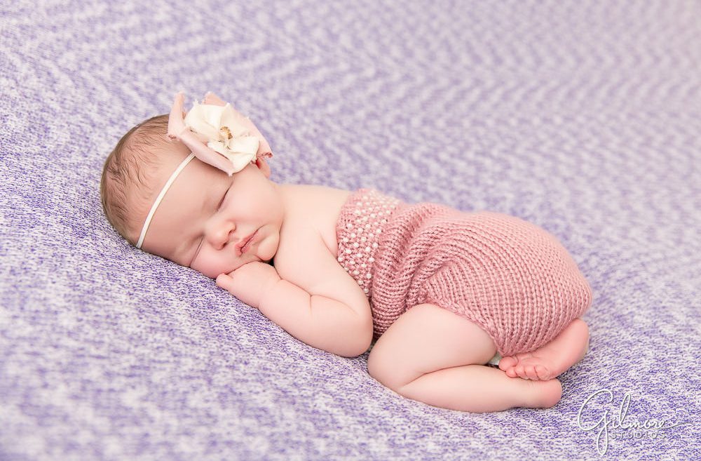 Newport Beach newborn photographer sleeping baby on purple and pink