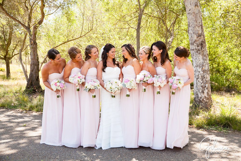 Bride and her bridesmaids holding their bouquets