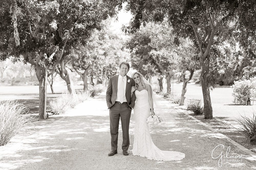 Bride and groom on the driveway outside the Bougainvillea estate