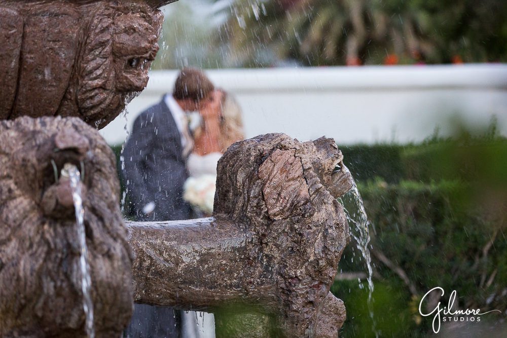 Kissing the bride by the fountain