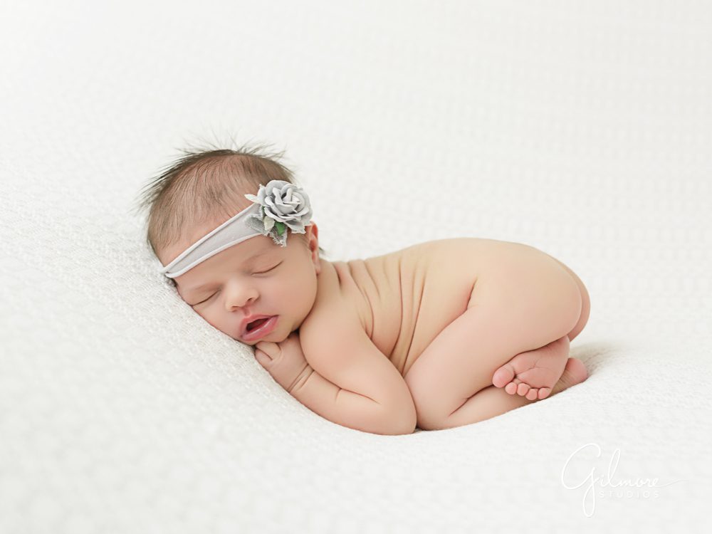 naked baby portraits at the studio on white