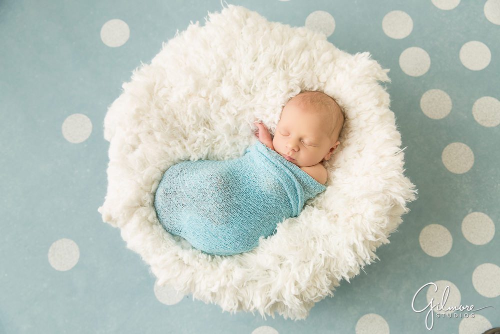 newborn baby boy portrait on blue