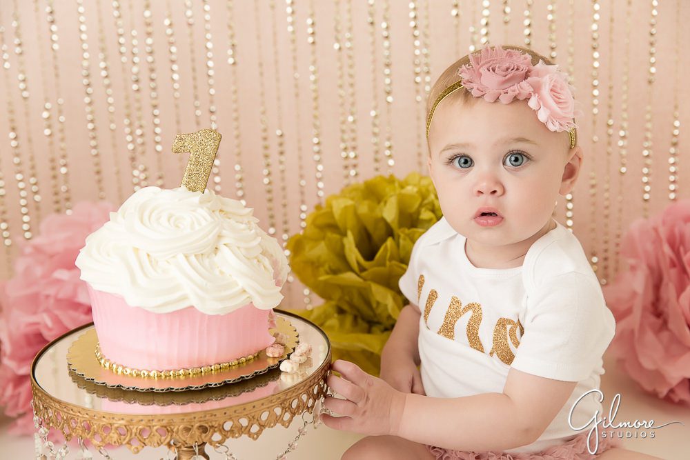 Pink and white birthday cupcake smash photo
