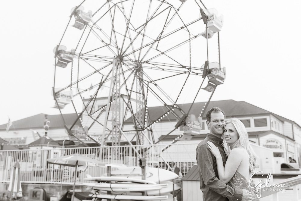 black and white engagement photo near the Balboa ferris wheel