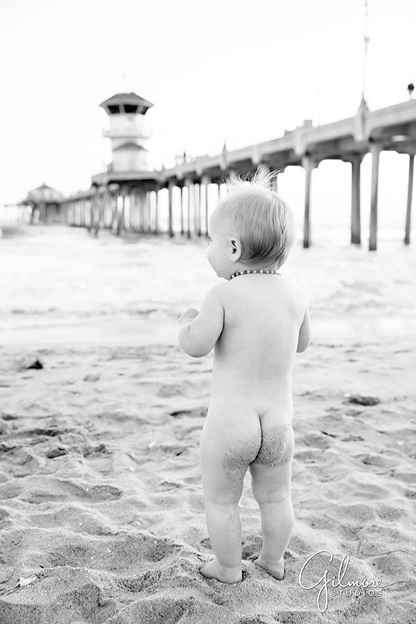 naked baby strolls on the beach - Huntington Beach family photography