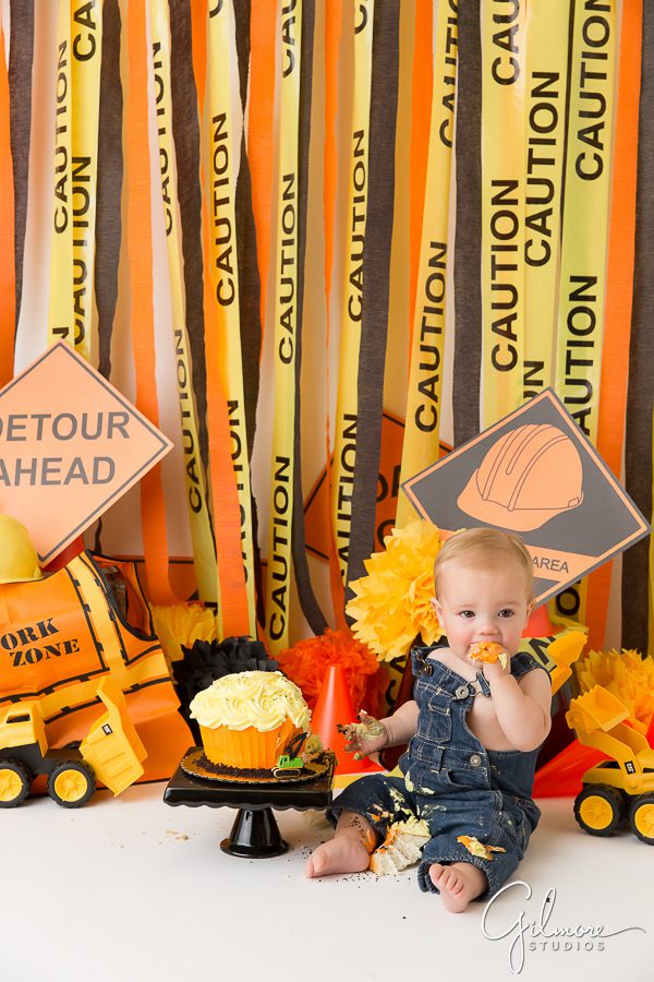 Construction props and birthday cake for a one year old