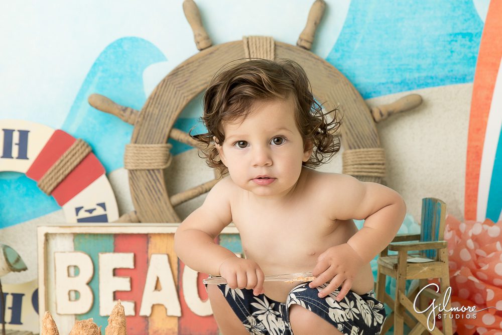 1 year old boy ready for his beach themed birthday portraits