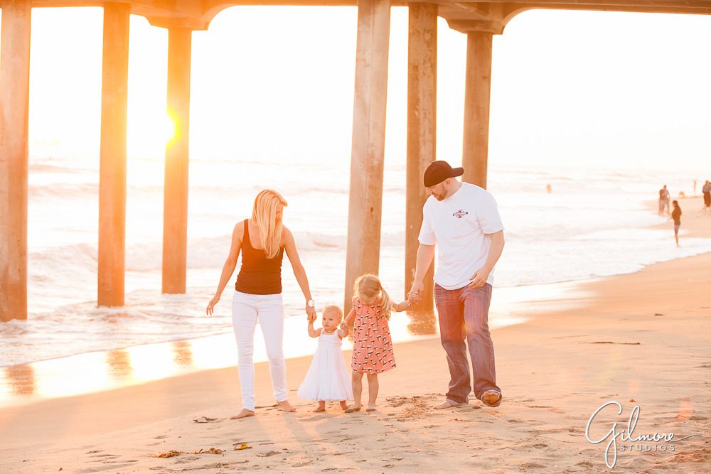 Family walking on the beach for a sunset portrait - Huntington Beach family photography