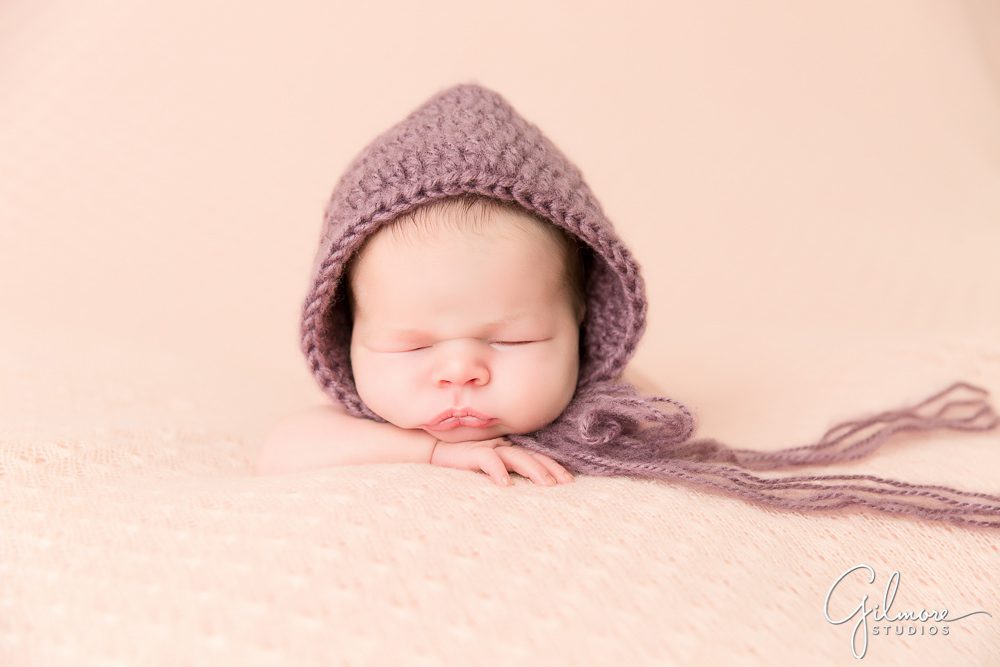 cute knitted hood for a newborn baby girl portrait session