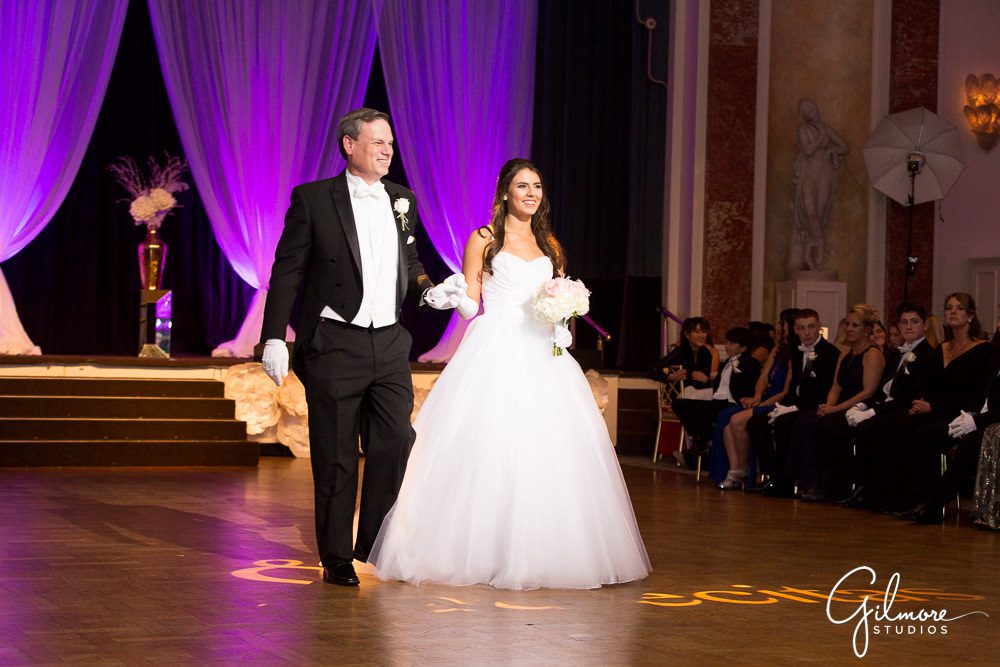 Father and daughter walk together at the Debutante Ball