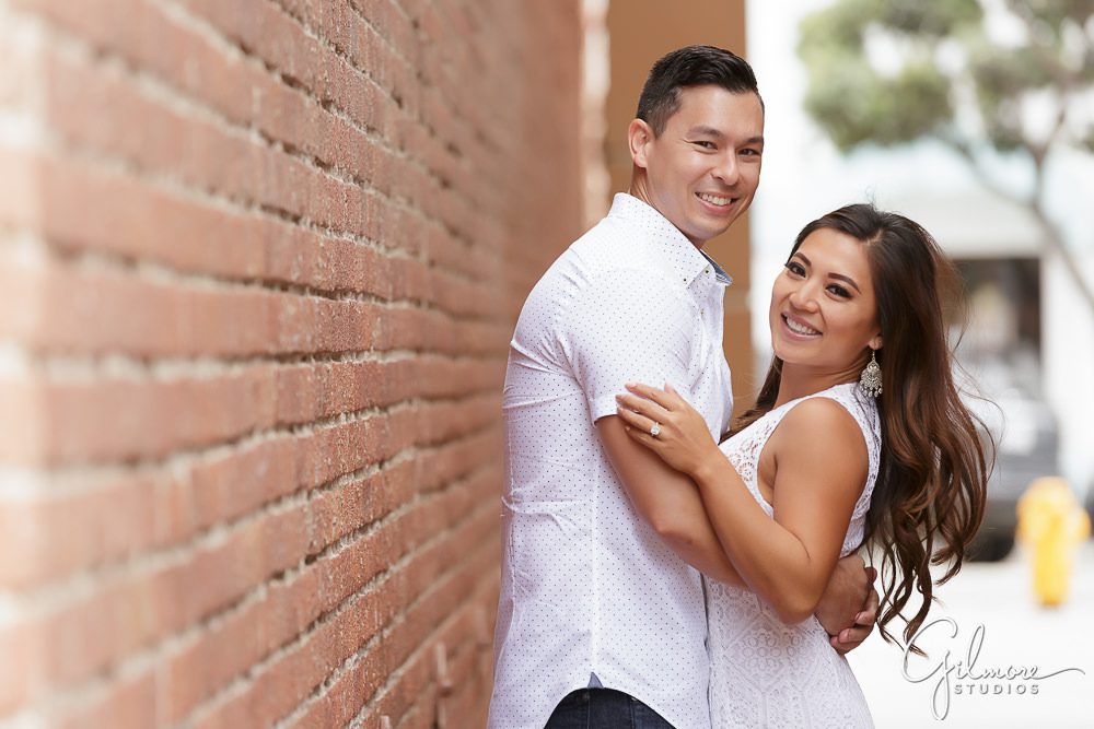 engagement photography, red brick wall, Engaged, surf city