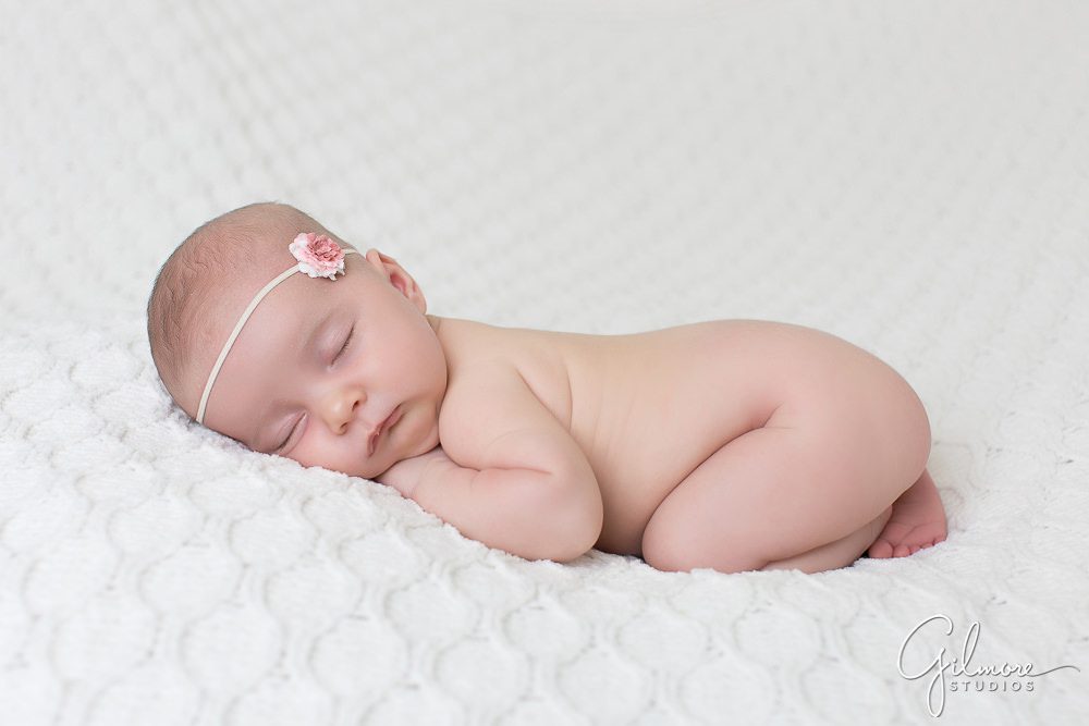Newport Beach newborn studio, simple baby pose, white blanket