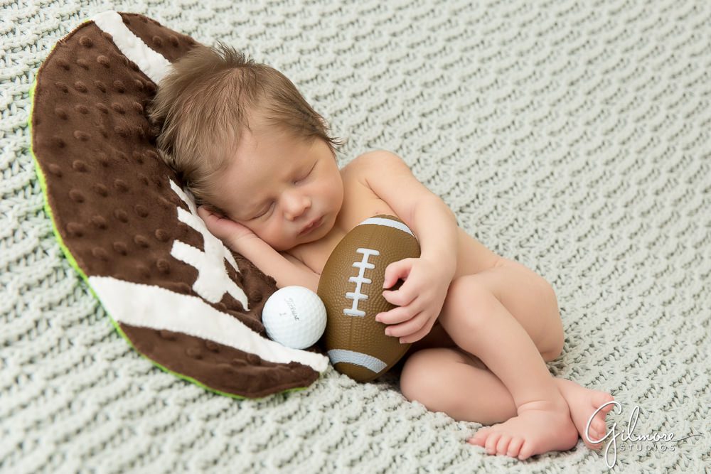 sports theme newborn baby boy portrait