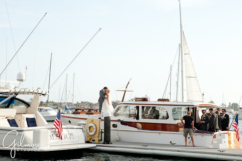 wedding couple arrives to the Balboa Yacht Club Wedding by sea