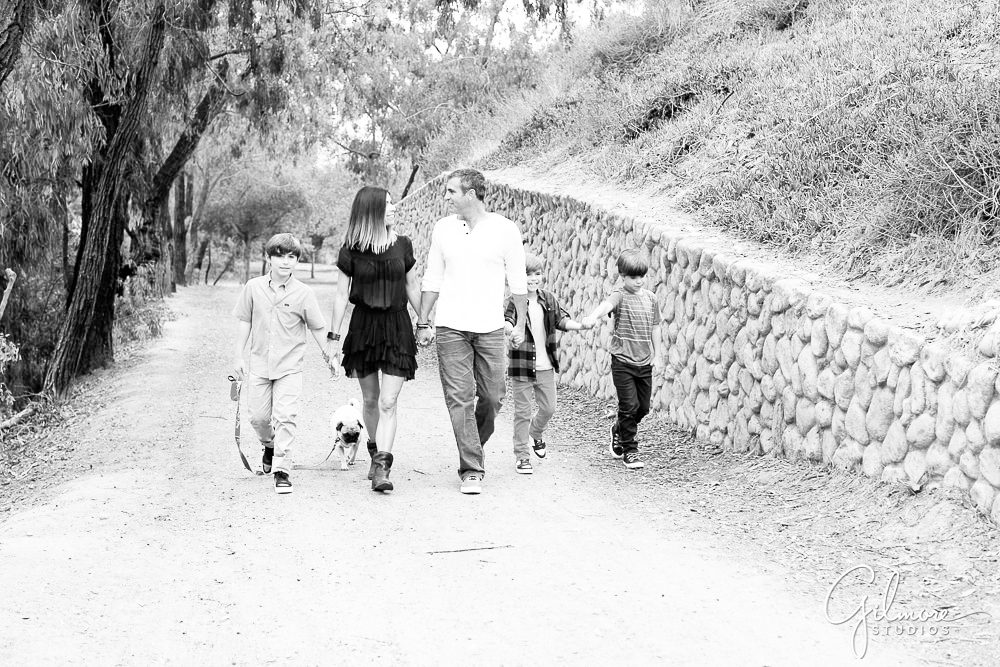 black and white family portrait, walking in the park