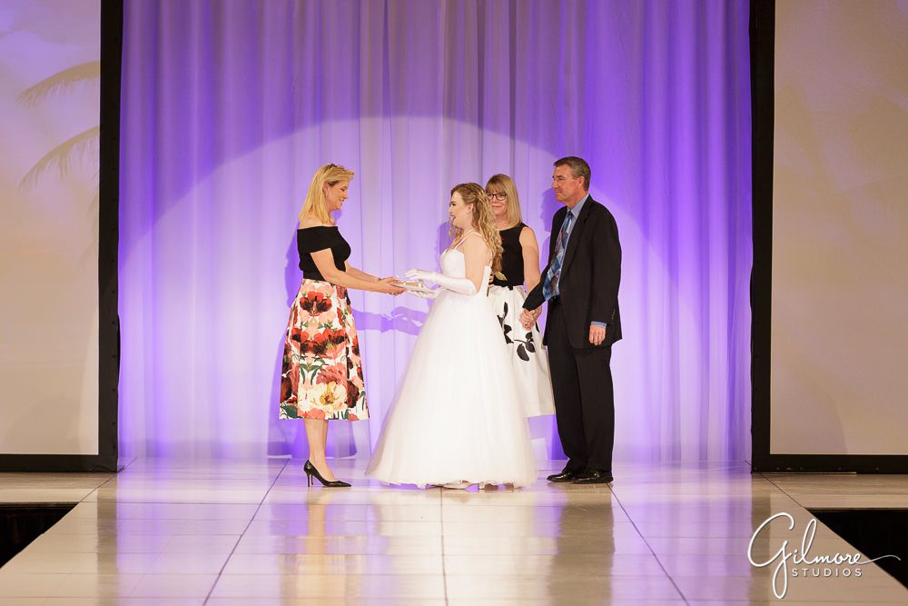 debutante greeting her parents at the Debutante Fashion Show