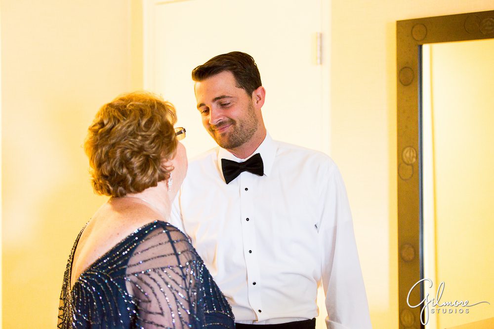 groom smiles at his mother before the wedding