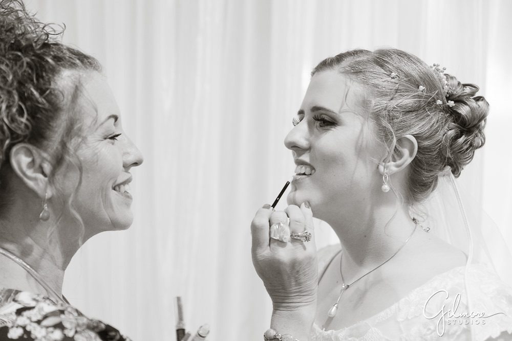make up artist working on the bride