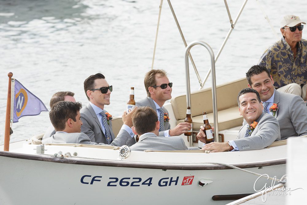 groomsmen wait on the boat before the wedding begins