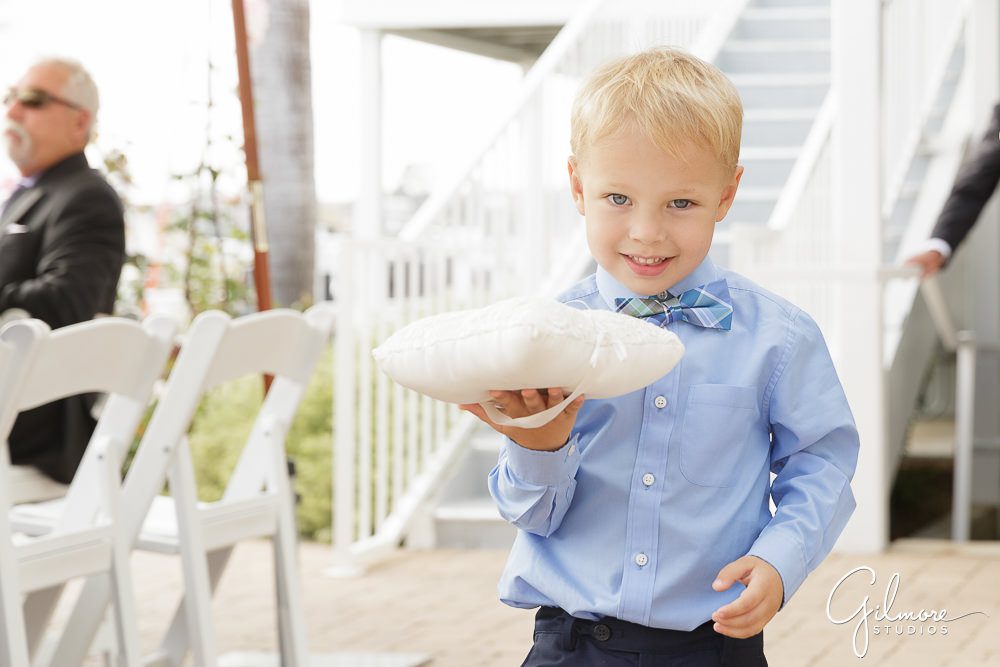ring bearer shows off his pillow