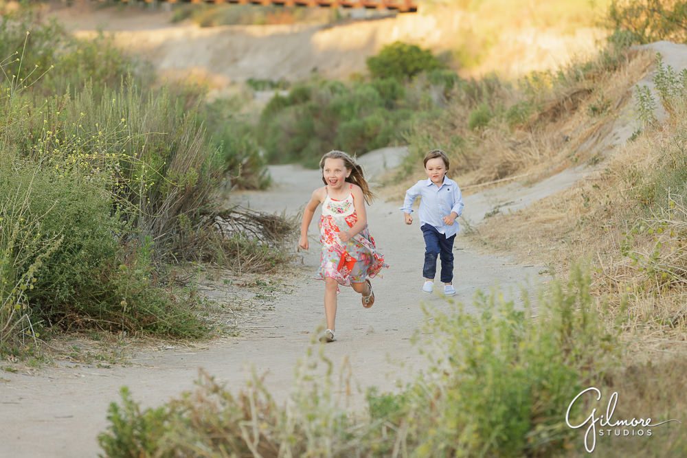 children playing on the trails at the back bay in Newport