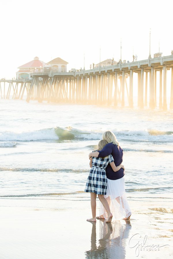 mother and daughter hugging on the beach, Huntington Beach Family Photographer