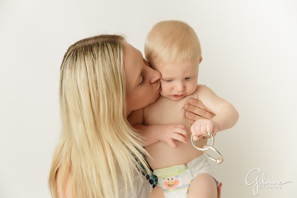 mother holding her 6 month old baby boy, Costa Mesa photography studio for babies