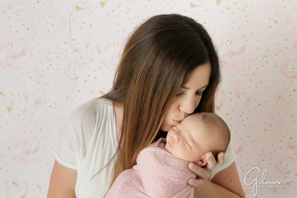 mother kissing baby girl, Orange County Newborn Photographer