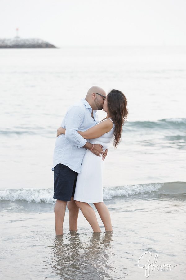 kissing on sand in Venice Beach, Venice Canals Engagement