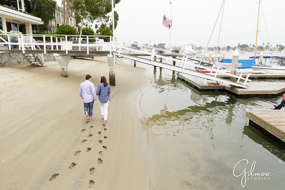 footsteps in the sand, Lido Isle Engagement Photography