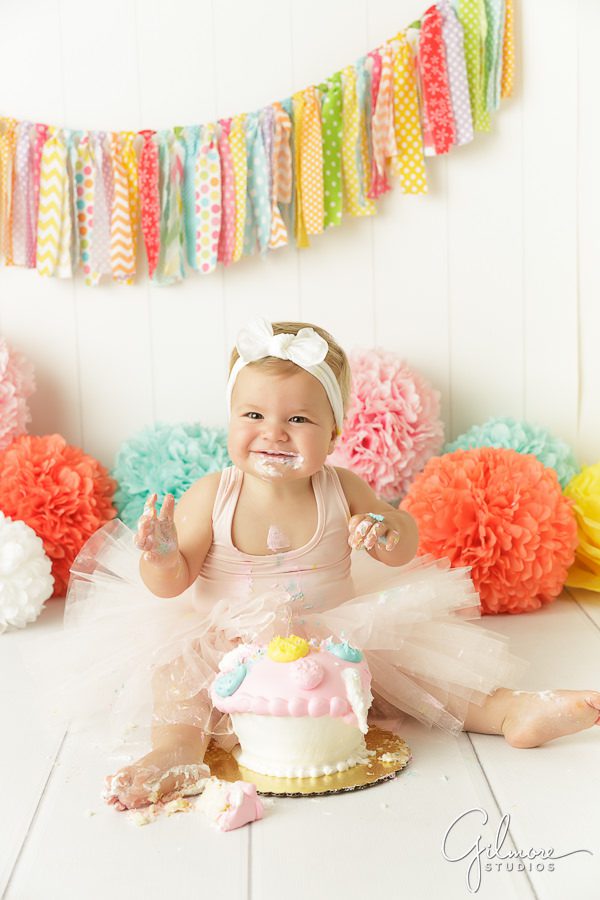 happy one year old girl, birthday girl, cake smash