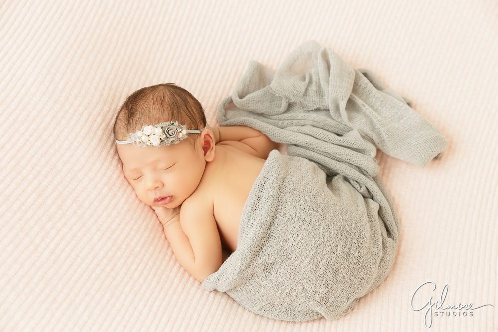 grey newborn wrap, pink background, newborn design studio