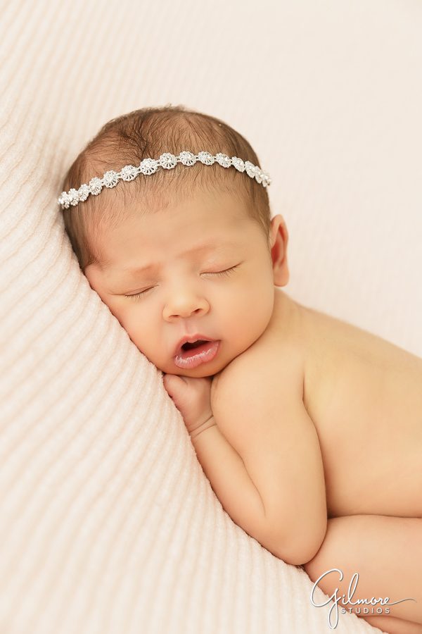 sleeping newborn baby girl, crystal bead headband