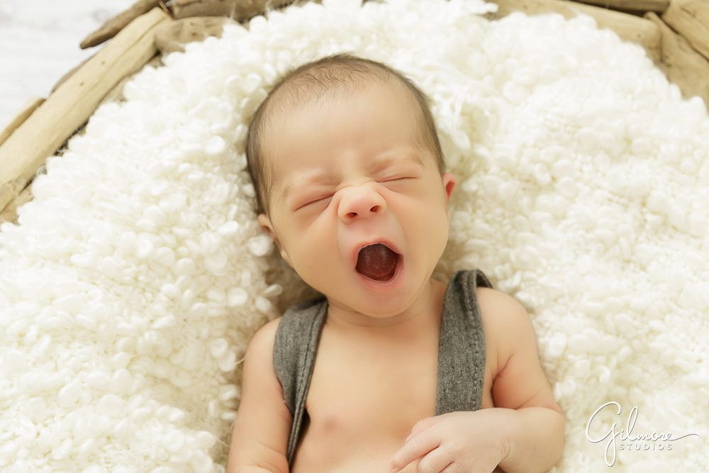 sleepy newborn baby bpy yawning