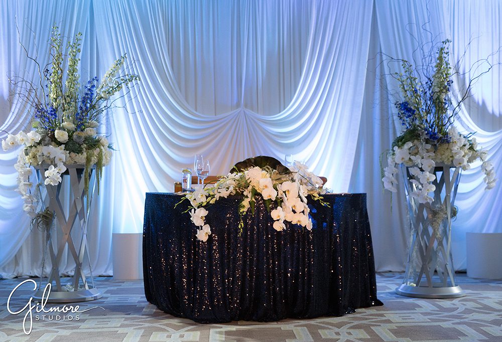 reception lighting, Surf and Sand Resort wedding, sweetheart table, decor, floral, design, wedding decorator,