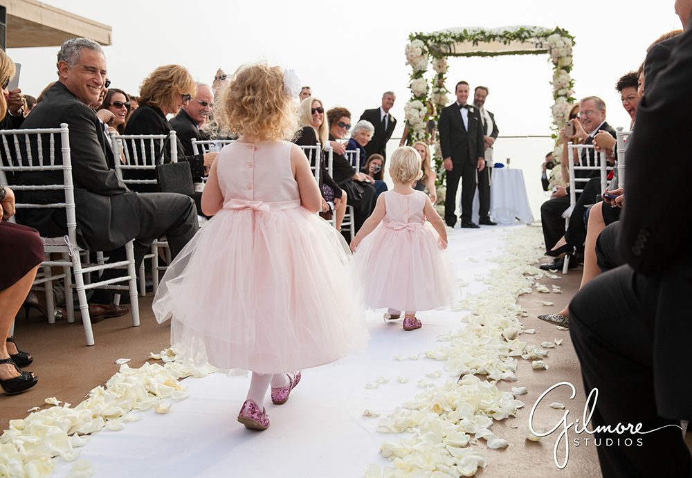 flower girls walking down the aisle, Surf and Sand Resort wedding ceremony