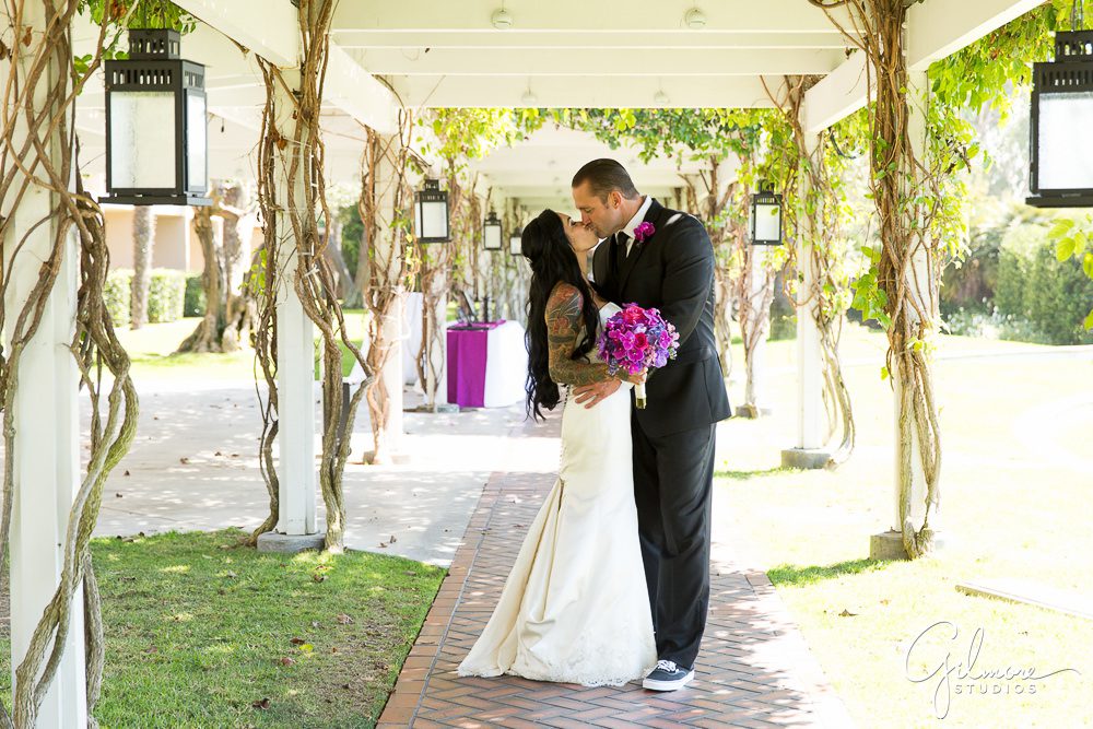 Hyatt Regency Newport Beach, bride, groom, kiss, first look, wedding, photographer, outdoor, arch, flowers, decor, decorations, bouquet, purple