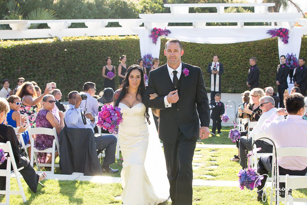Hyatt Regency Newport Beach, bride, groom, wedding, ceremony, exit, photographer, outdoor, flowers, floral, purple, arch, dress