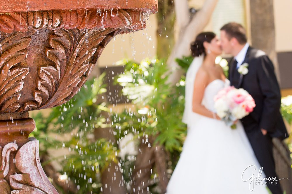 Hyatt Regency Newport Beach, wedding, bride, groom, kiss, fountain, photographer, outdoor, portrait, dress, flowers