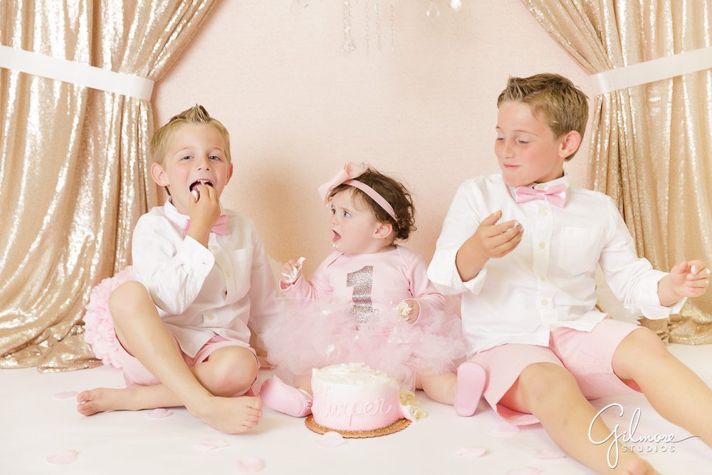 Ballerina Cake Smash Session, family portrait shoot, studio portraits, baby, first birthday, brothers, siblings, matching outfits, pink, skirt, shorts, drapes, backdrop
