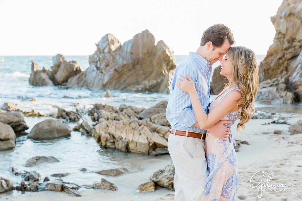 Newport Beach Engagement Session, little corona del mar, engaged couple, kiss, rocks, waves, sand, ocean, portrait, southern california lifestyle, sunset