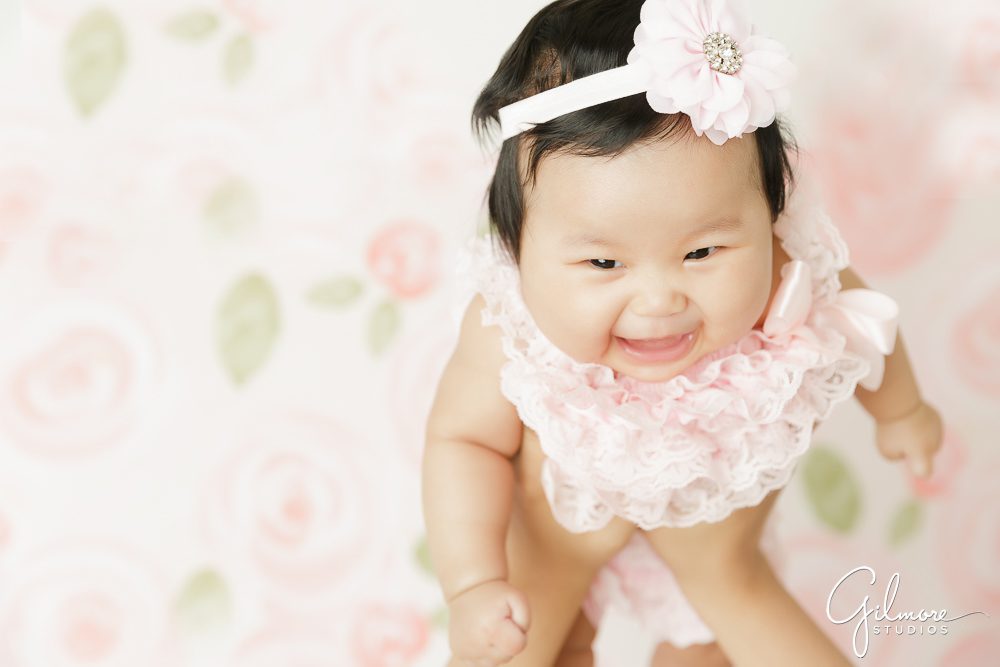100 Days Baby Photography Session, flying, laughing, floral headband, floral backdrop, portrait, kids photographer, pink newborn dress