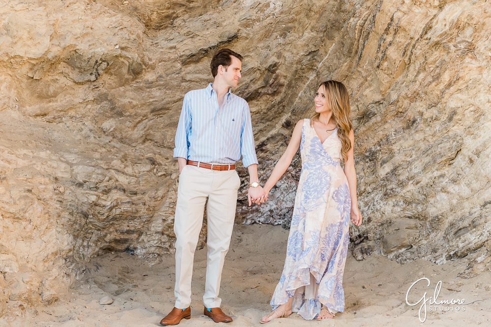 Newport Beach Engagement Session, engaged couple, portrait locations, southern california lifestyle, sunset, natural light, holding hands, cliffs, sand, little corona del mar