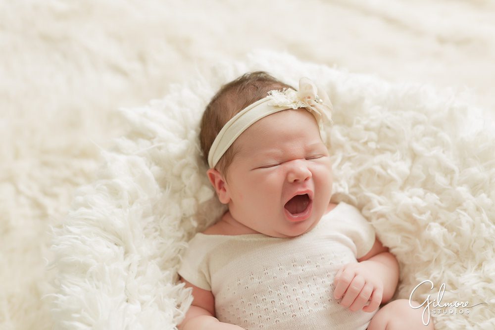 Orange County Newborn, baby, headband, white blanket, crying, portrait, sleeping